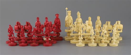 An early 19th century Chinese red stained and natural ivory rosette type chess set, kings 3.25in.
